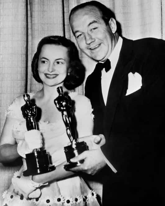 Best actor winners Olivia de Havilland ("The Heiress") and Broderick Crawford ("All the King's Men") pose with their Oscars in 1950.