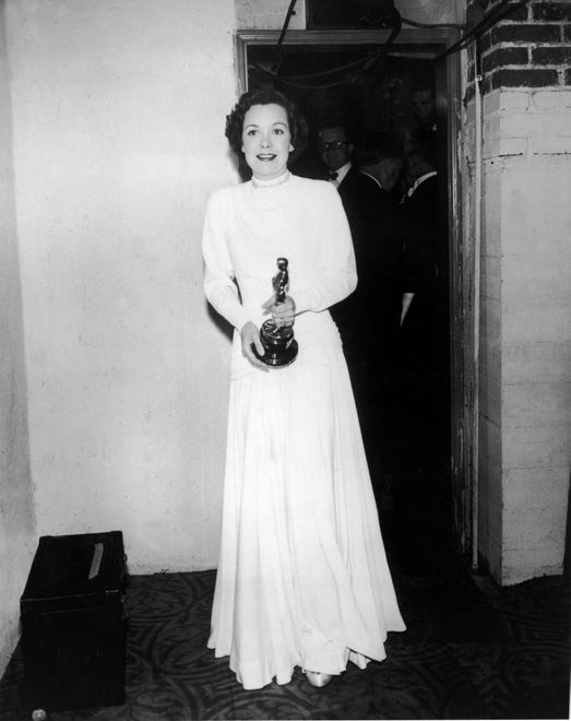 Jane Wyman, then married to future President Ronald Reagan, carries her Oscar for best actress in "Johnny Belinda" as she navigates backstage at the Oscars in 1949.