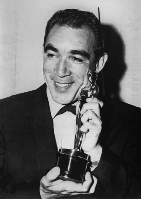 Anthony Quinn shows off his Oscar for best supporting actor in "Lust for Life" in 1957.