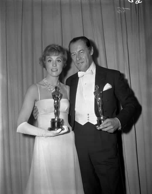 Julie Andrews, best actress for "Mary Poppins," and Rex Harrison, best actor for "My Fair Lady," display their Oscars backstage in 1965.