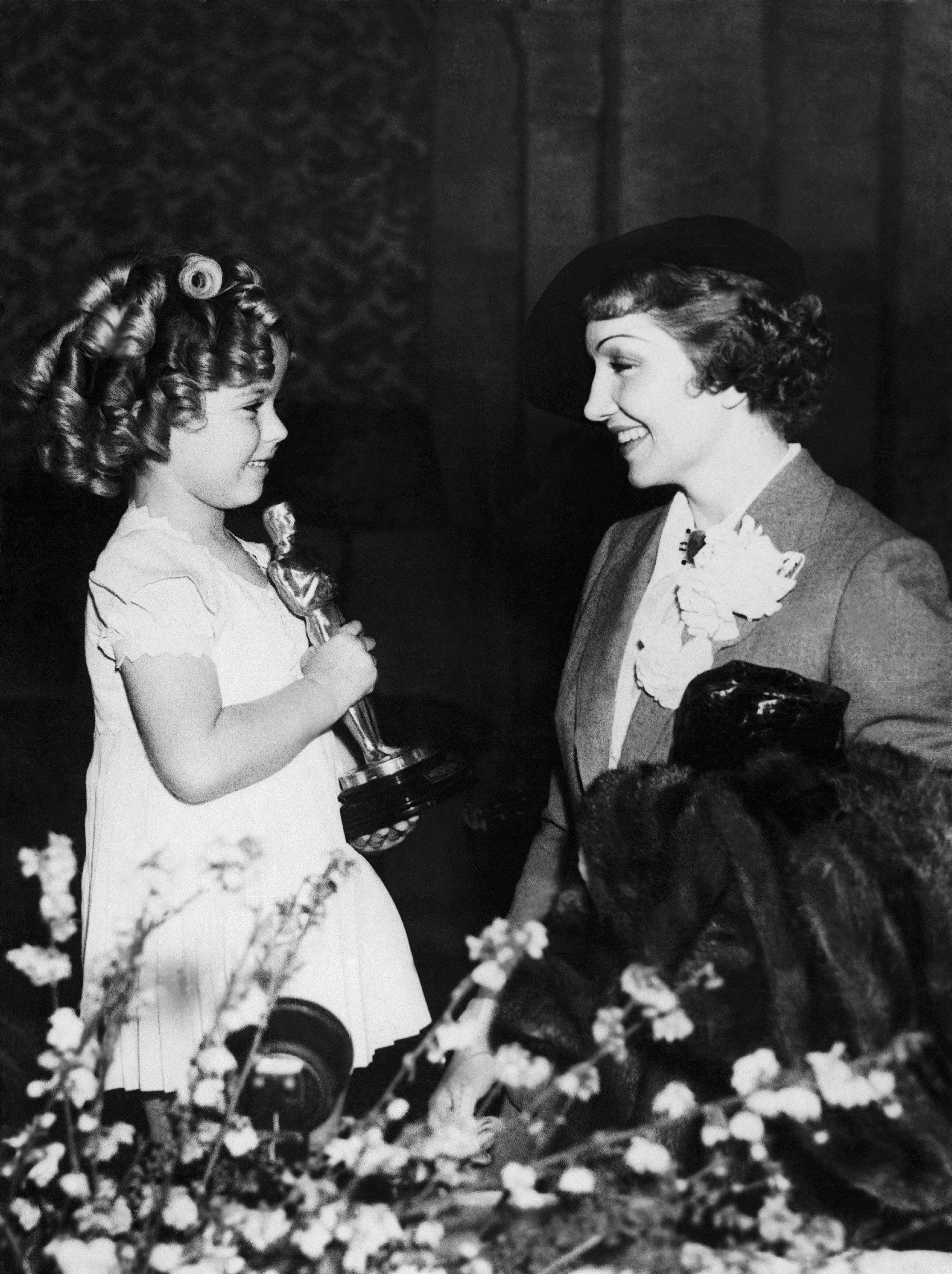 Shirley Temple And Claudette Colbert At The Oscars 1935 shirley temple and claudette colbert at the oscars 1935